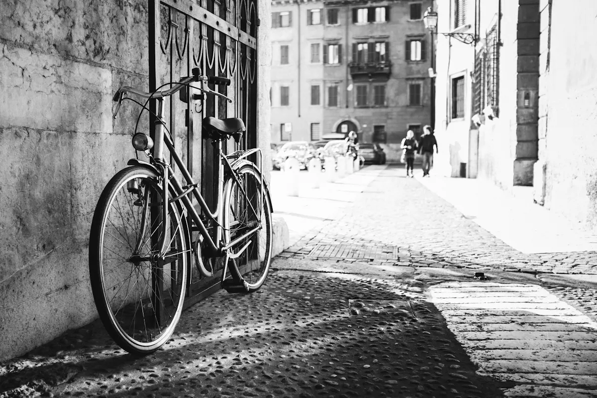 a bicycle parked on the side of a building