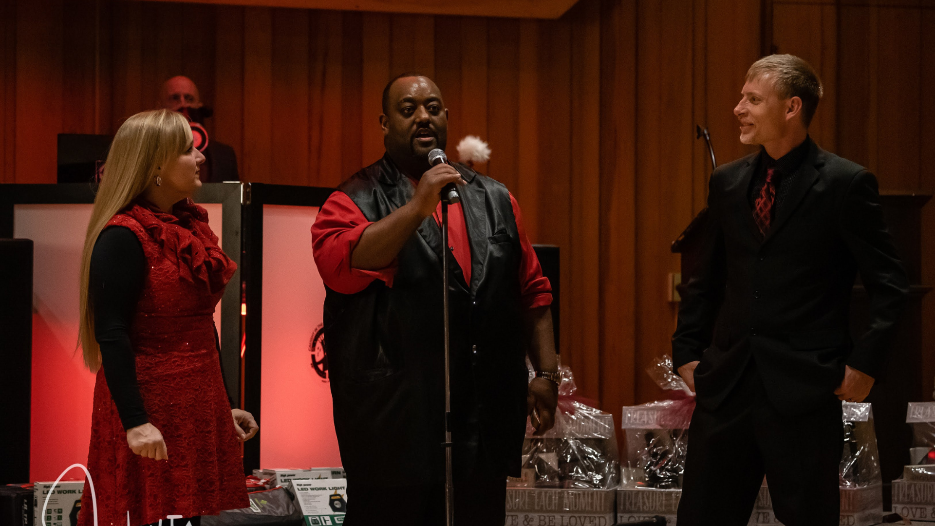 Dewayne Hill performing comedy magic with guests at a live event
