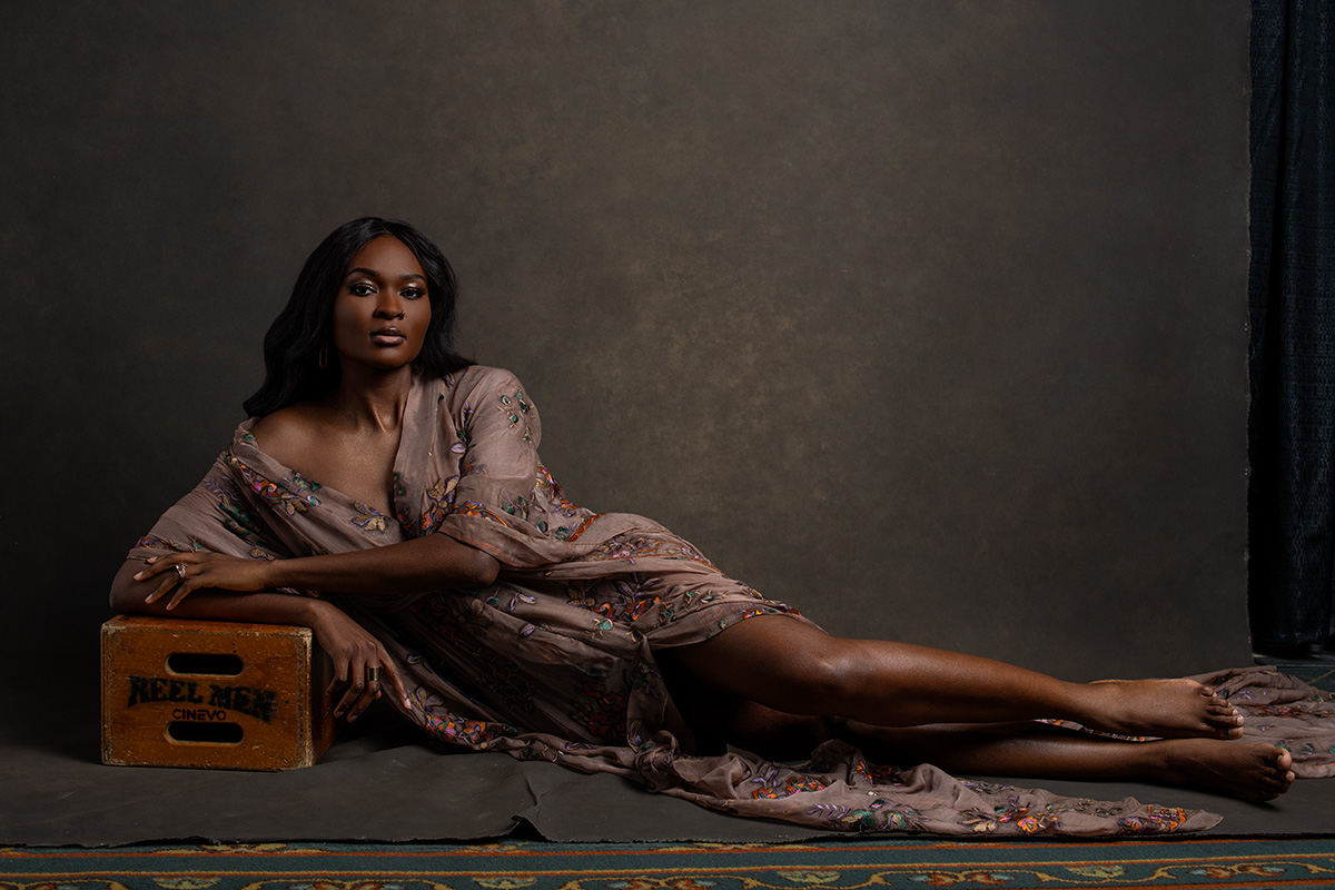 Studio beauty portrait of a woman reclining in an elegant robe, luxury boudoir inspired photography in The Villages, Flo