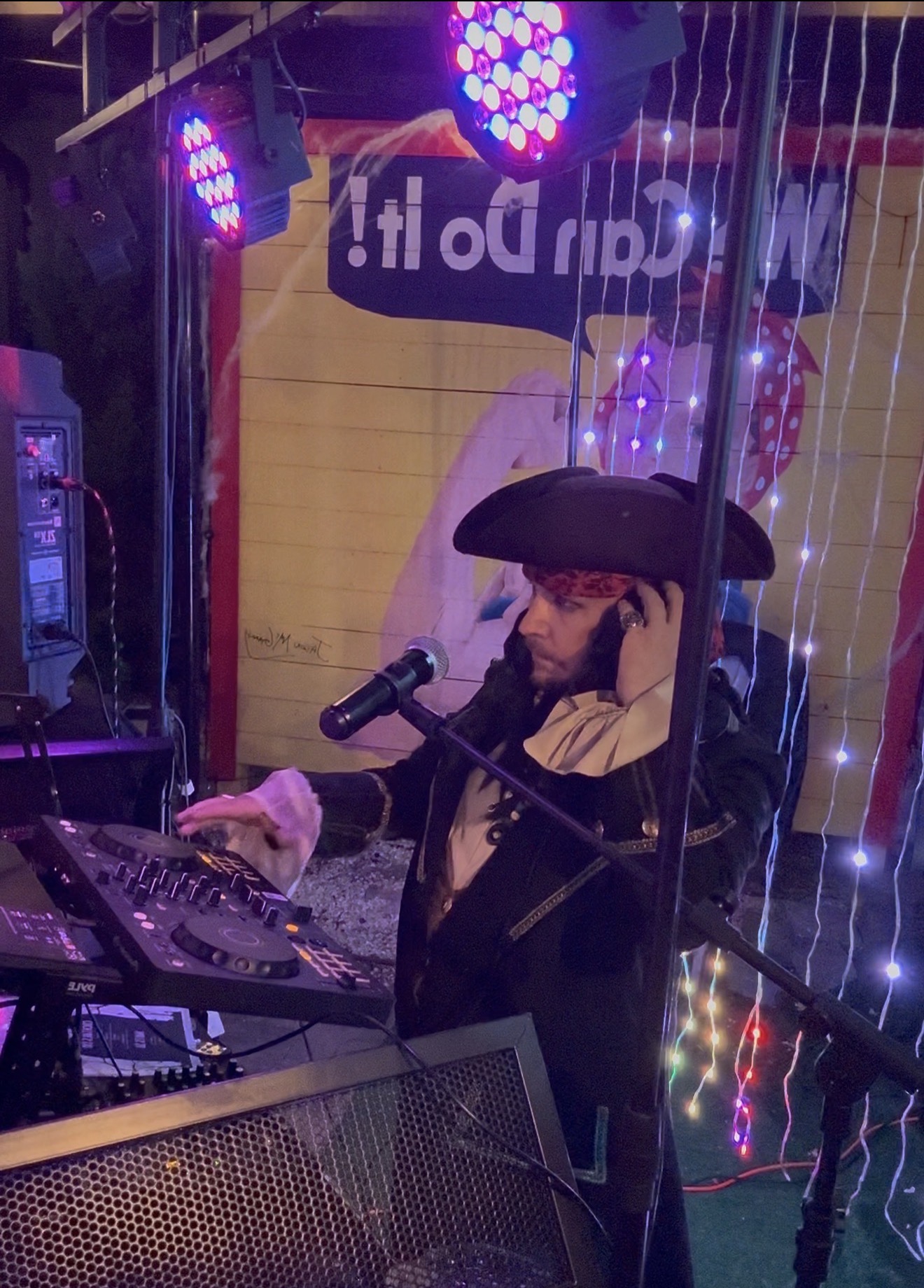 DJ Mike performing in a Halloween costume at an event with Premier DJ Services
