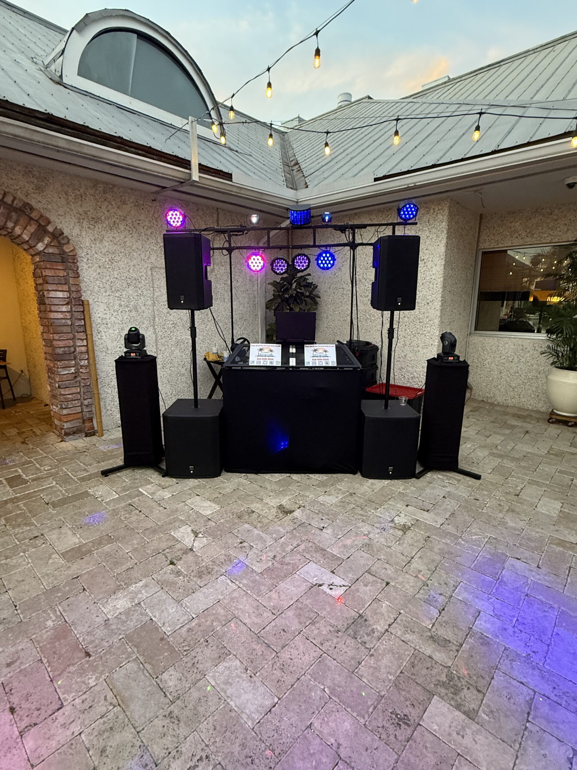 Professional DJ setup with speakers and lighting by Premier DJ Services