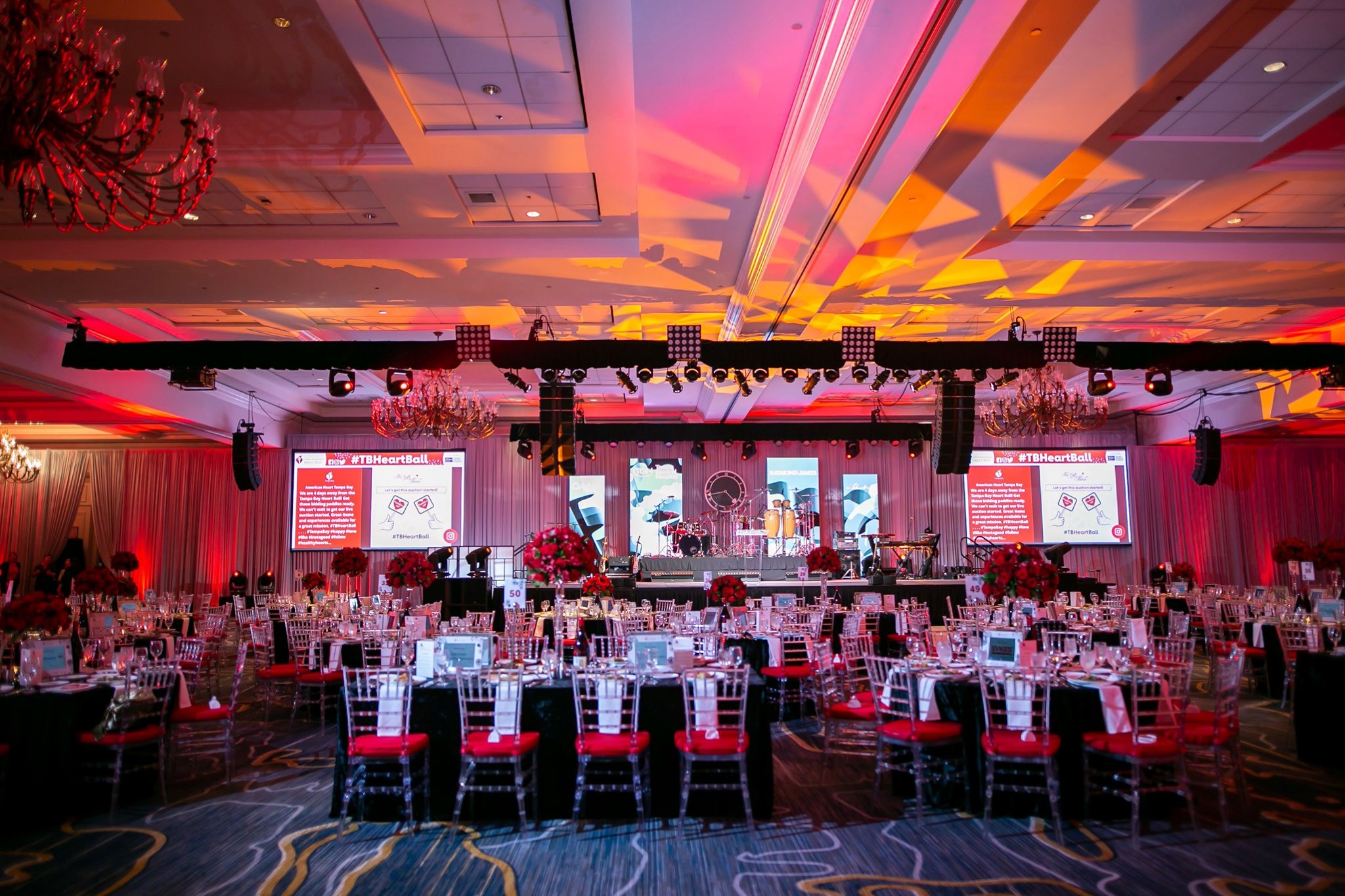 Fundraising event stagewith video screens and professional lighting