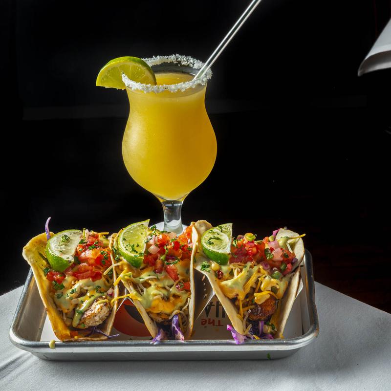 Blackened Mahi tacos and a cocktail.