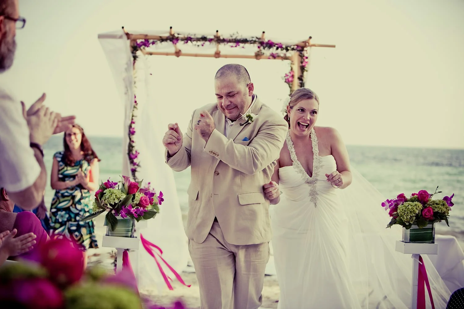 Orlando wedding photographer's Fun beach wedding photo in Key West, Florida at Waldorf Astoria