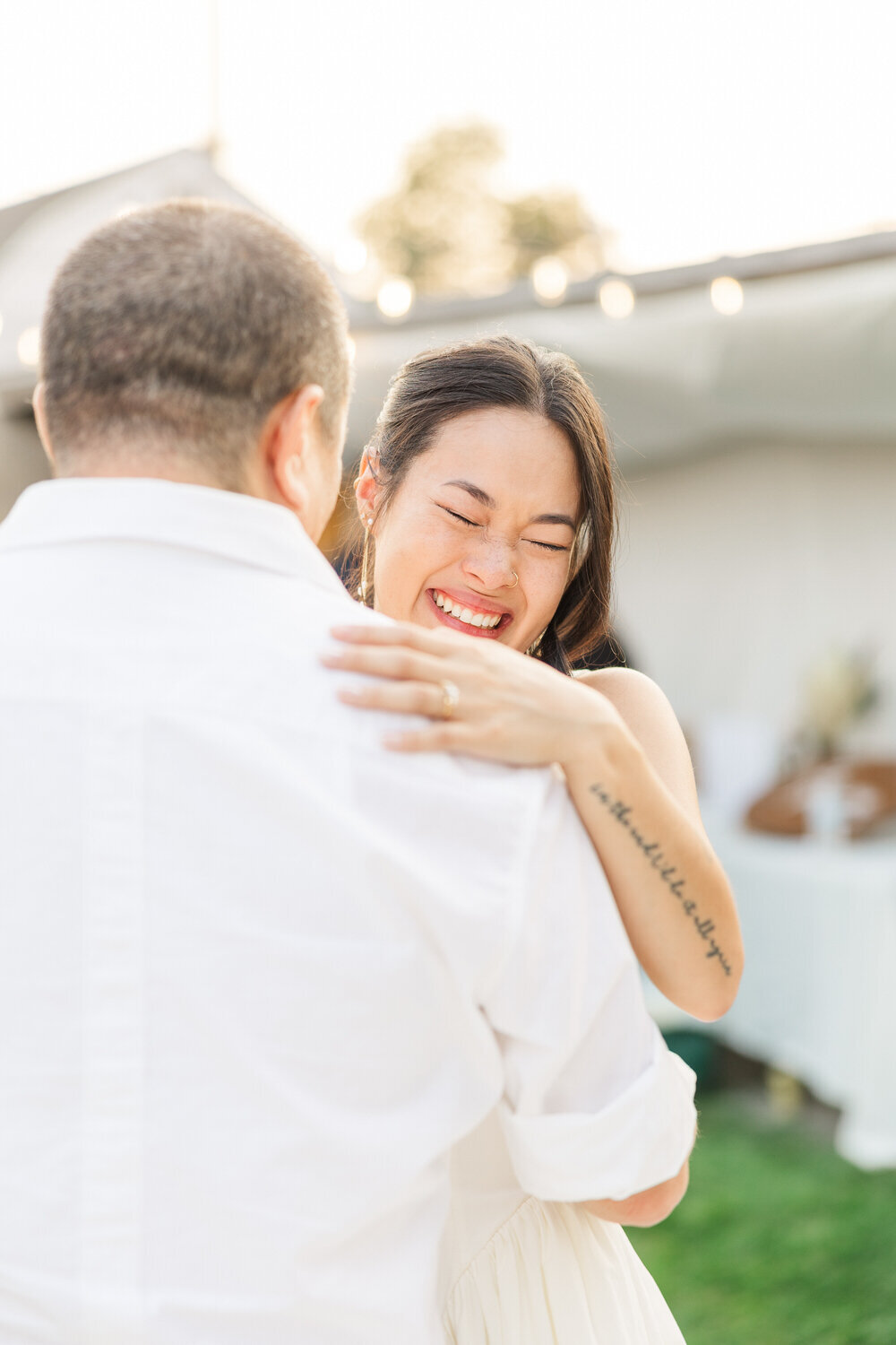 Dad dancing with daughter on the brides first dance, photo taken in her backyard at her wedding