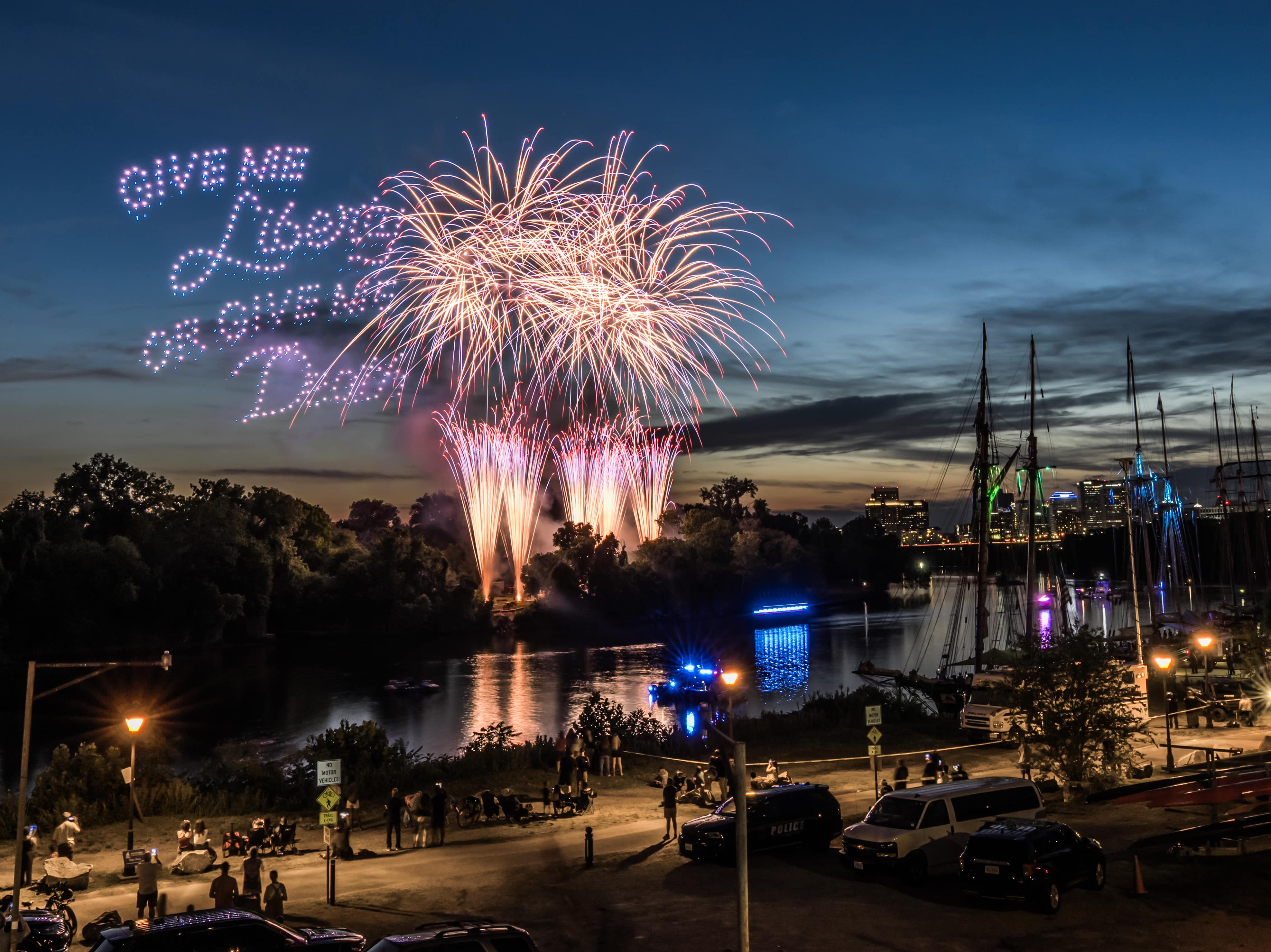 Drones spell "Give me Liberty or give me Death" beside fireworks over the James River at Richmond SailFest, wi
