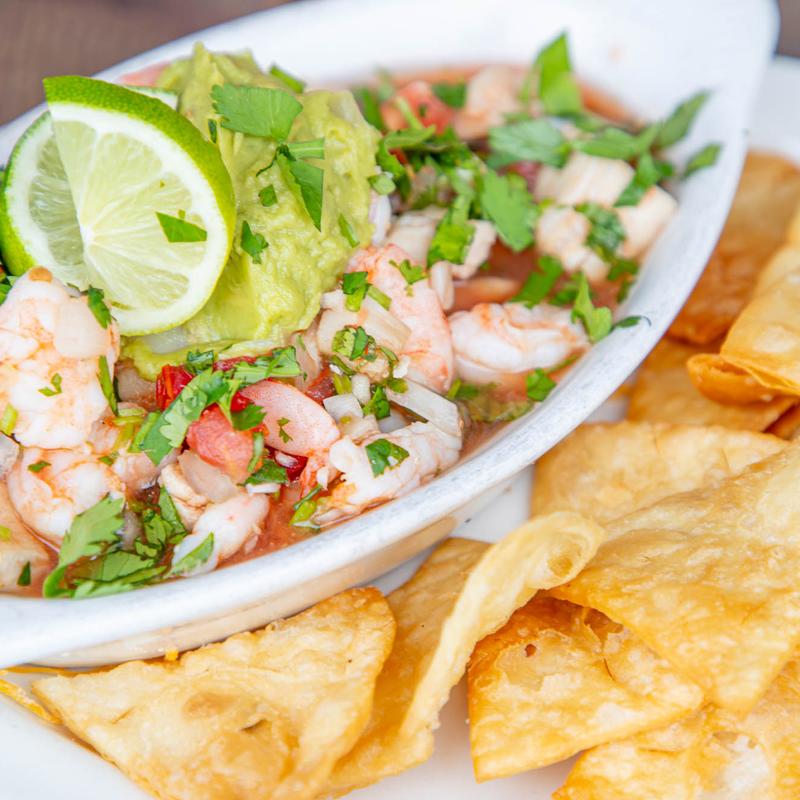 Shrimp, scallop, and fish ceviche, served with tortilla chips.