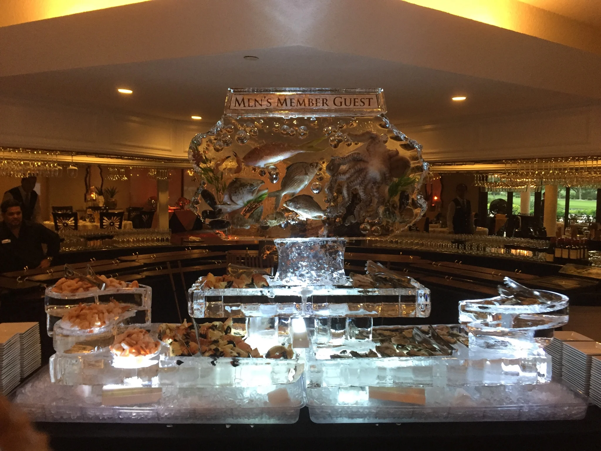 Ice sculpture buffet display with chilled seafood platter, tabletop ice bar for catering | The Ice Butcher