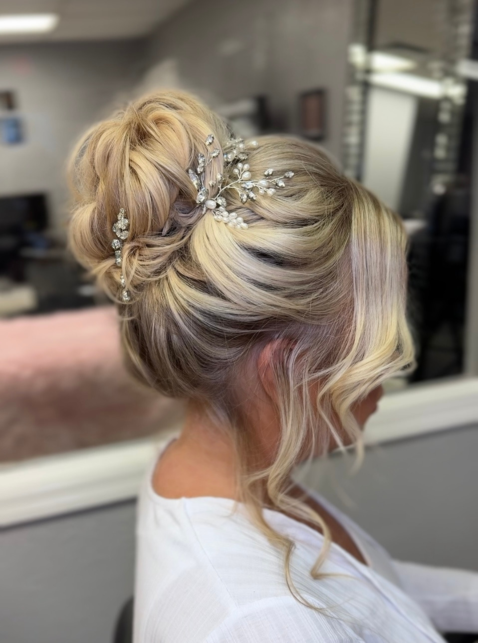 Timeless bridal updo with elegant styling and smooth polished volume