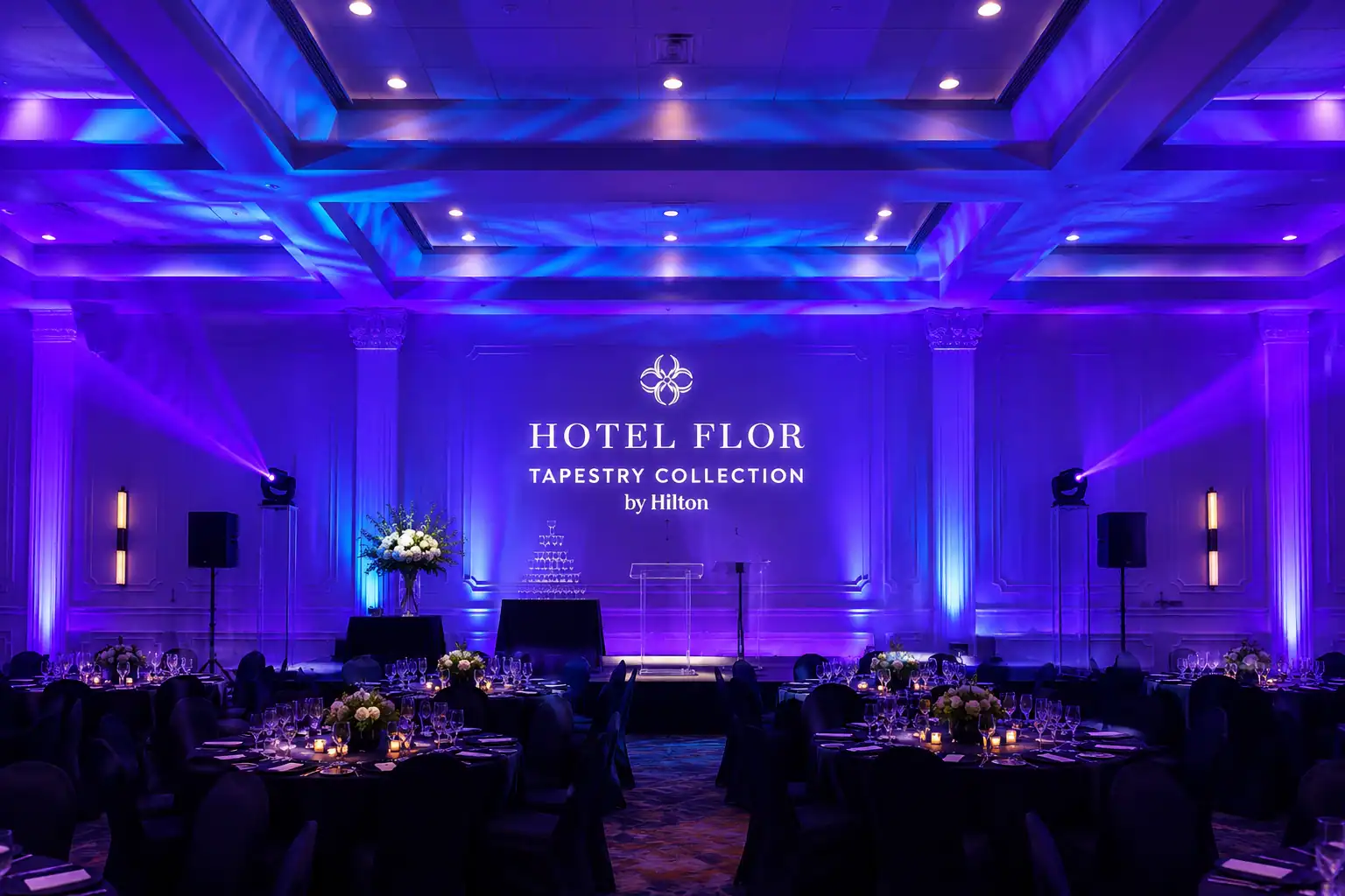 Orlando hotel ballroom transformed with blue corporate event lighting and stage illumination by TYLERLIGHT