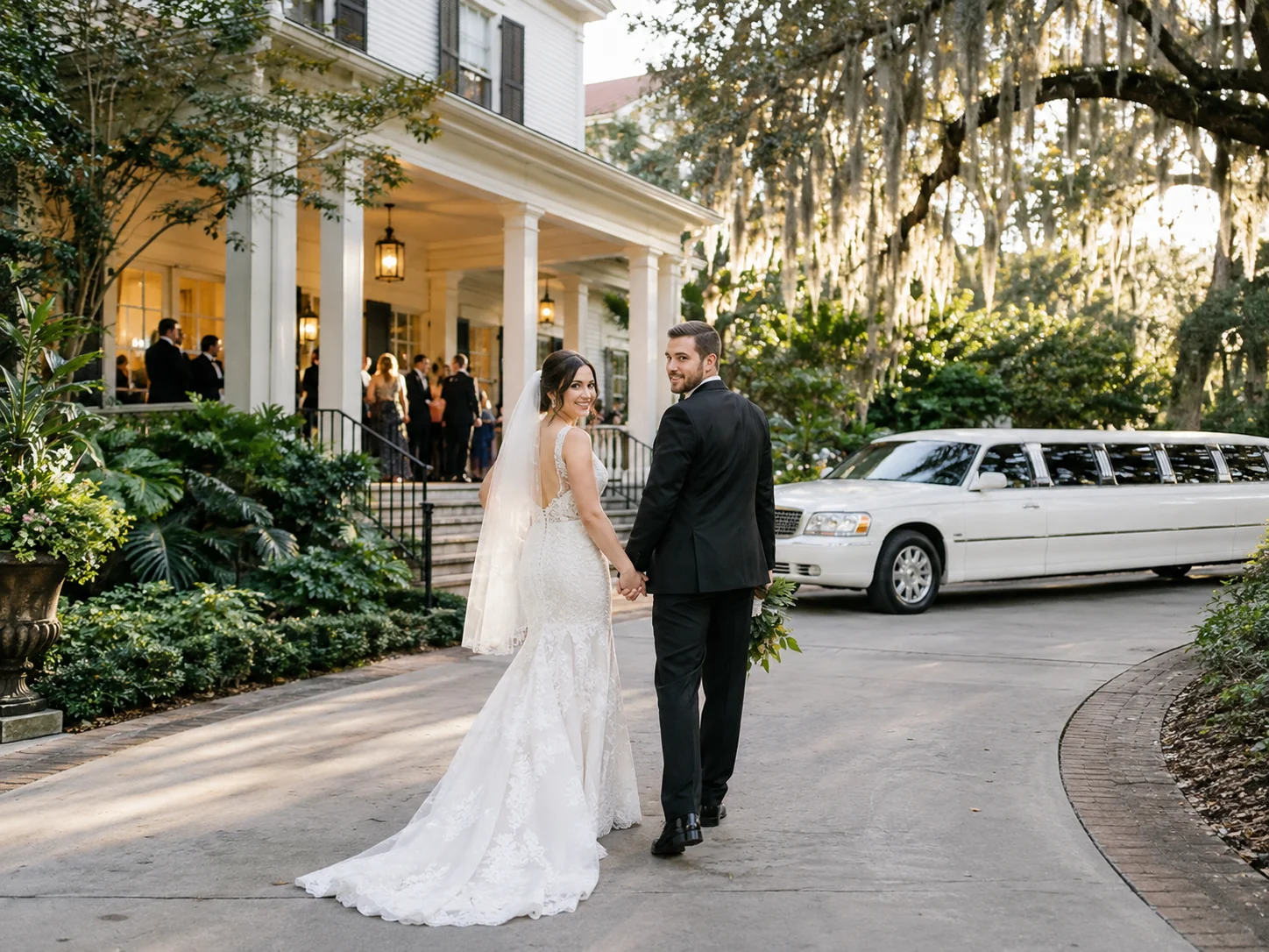Bride and groom arriving at a Gainesville wedding venue with white limousine